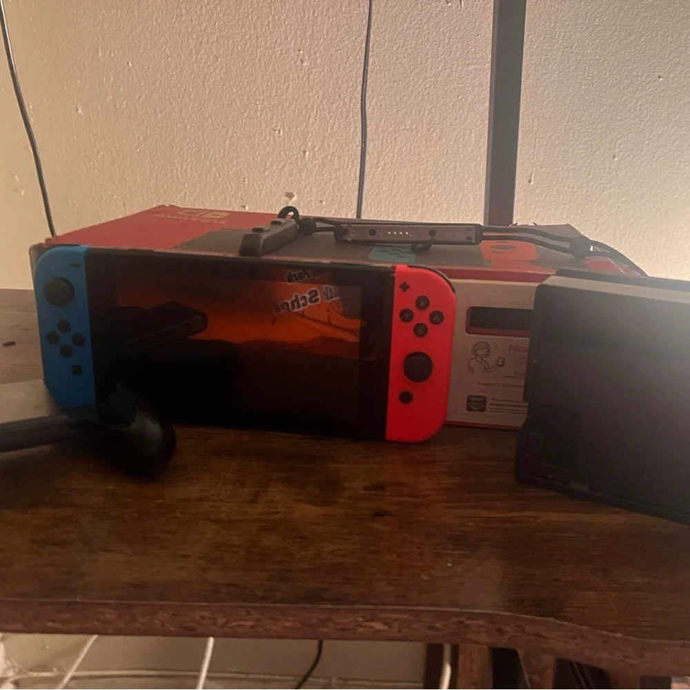 Nintendo Switch Console with Red and Blue Controllers